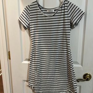 Black and white strip dress by Persun. Girls Size small.